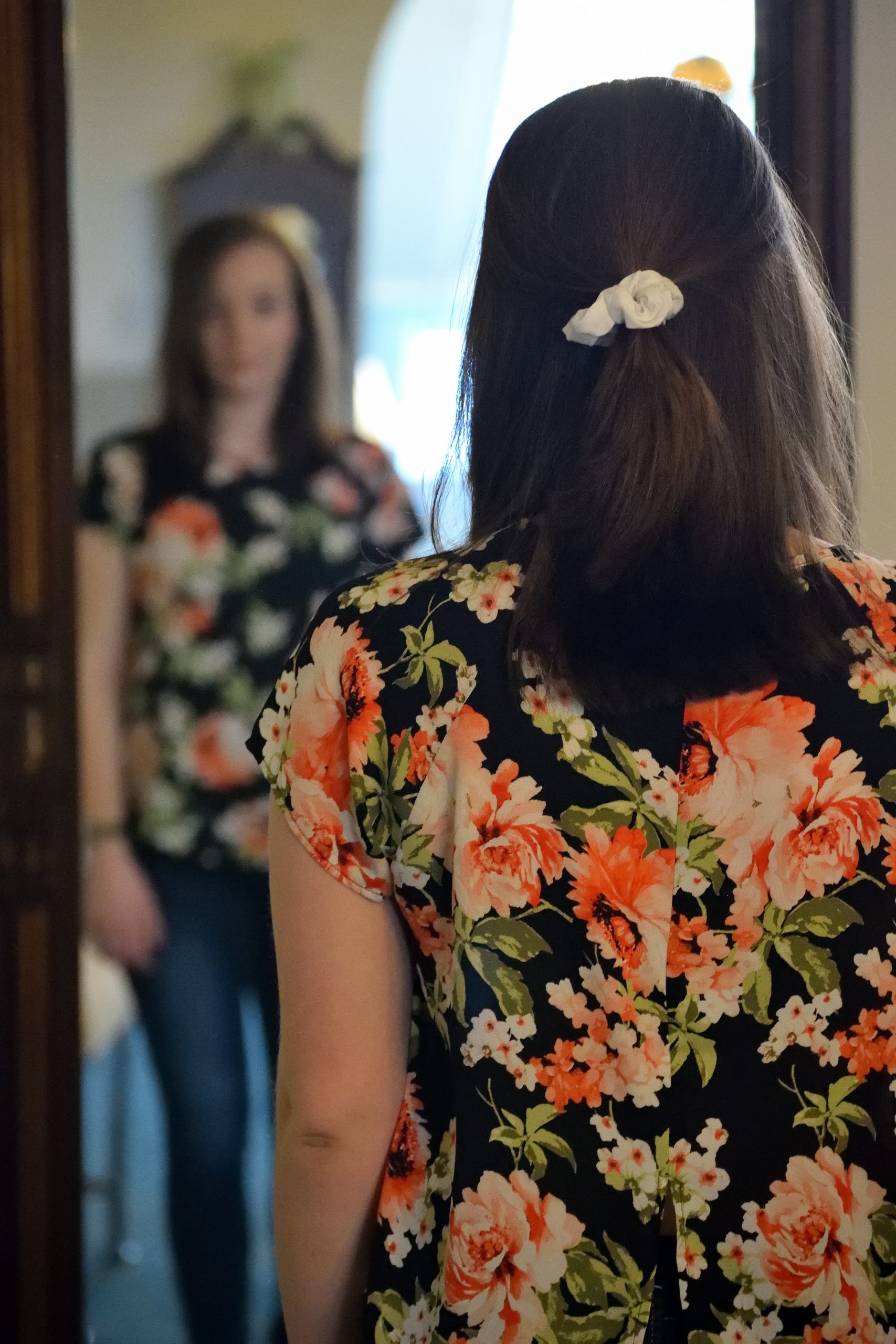 Woman looking in mirror